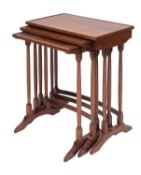 A nest of three mahogany and line inlaid occasional tables in Regency taste,