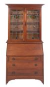 A mahogany and stained glass bureau bookcase in Arts & Crafts taste,