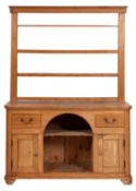 A 19th-century pine dresser; with an open shelved superstructure,