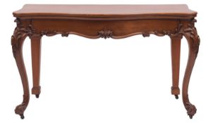 A carved oak serpentine fronted serving or console table in Louis XV style,