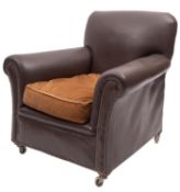 A leather upholstered armchair,