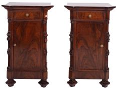 A pair of Italian walnut bedside cabinets, last quarter 19th century; the tops with moulded edges,