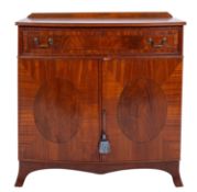 A mahogany and line inlaid bow front side cabinet in Regency style,