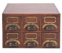 An Edwardian oak counter-top filing box,