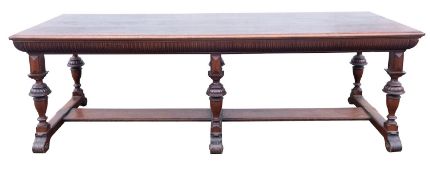 A Victorian walnut dining table in Antiquarian taste, by James Shoolbred,& Co.