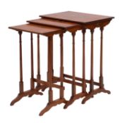 A nest of three painted satinwood occasional tables, in George III Sheraton style,