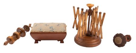 A Victorian treen bobbin stand, late 19th century; with turned table clamp base,