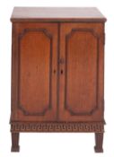 A Regency mahogany butler's cabinet, early 19th century; the top with moulded edges,