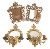 A pair of gilt metal framed twin light girandoles,