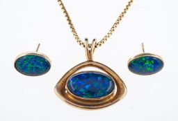 An opal doublet pendant and earrings set in silver gilt