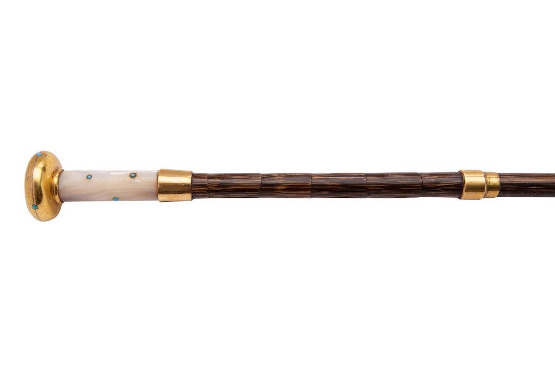 A palmwood, turquoise, mother of pearl and gilt metal mounted walking stick, late 19th century, - Image 1 of 2