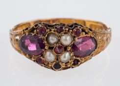 A Victorian ring set with amethyst and seed pearls, engraved band, marks for 15ct, Birm, 1879,