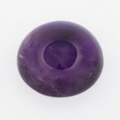 A loose amethyst quartz carbochon gemstone,