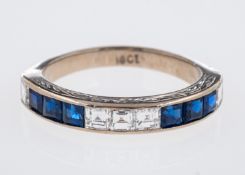 A sapphire & diamond set eternity ring,