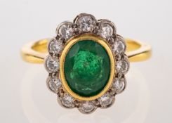 An emerald and diamond ring,