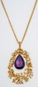 A gold pendant set with a pear form amethyst drop and small diamonds in naturalistic setting, 3.