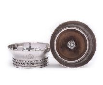 A pair of Arts and Crafts silver wine coasters by Omar Ramsden, London 1933,