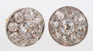 An Edwardian diamond set earrings, set with old cut stones in a millgrain setting,