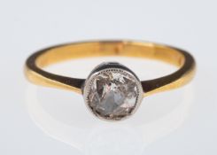 A single stone ring set with an old cut diamond estimated at 0.