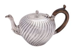 A Victorian silver tea pot by Charles Stuart Harris, London 1882,