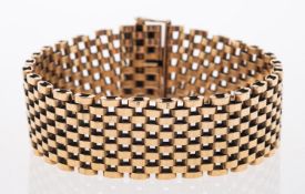 A 9ct gold bracelet, composed of polished brick links, with a concealed clasp,
