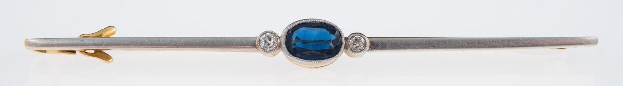 An Edwardian sapphire and diamond brooch, the sapphire of good colour,