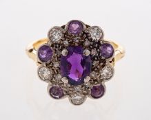 An 18ct gold, Amethyst & diamond cluster ring,
