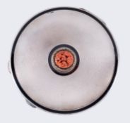 An Art Deco silver enamel and coral compact, with engine turned decoration and marcasite,