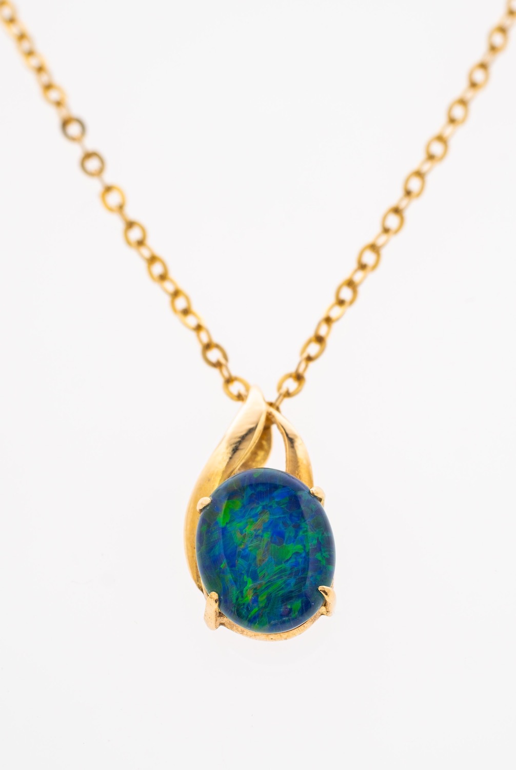 An opal pendant set in 18ct gold,