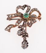 An emerald and diamond brooch,