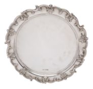 A George V silver salver by Walker and Hall, Sheffield 1929, with applied 'C' scrolled rim,