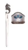 An Arts & Crafts silver and enamel napkin ring by Liberty & Co.