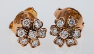 Diamond flower head earrings, post fittings for pierced ears, unmarked yellow metal,