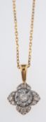 A flower head pendant set with small diamonds in white and yellow gold, on fine gold chain,