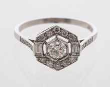 An Edwardian style diamond ring, set with a centre stone estimated at 0.