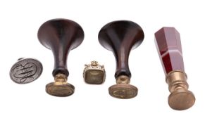 Five 19th century seals, comprising: a banded agate handed desk seal,