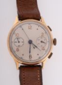 A gentleman's 18ct gold chronograph the matt silvered dial with Arabic and dot numerals,