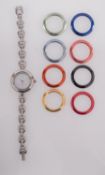 Gucci, a lady's wristwatch with changeable coloured bezels the white dial signed Gucci,