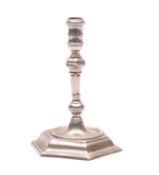 A George II cast taperstick, obscured maker's mark, London 1725,