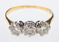 A three stone diamond ring set with brilliant cut diamonds in 18ct white and yellow gold,