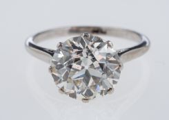 A solitaire diamond ring, the transitional cut stone of around 3.