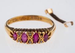 A gold ring set with marquise form rubies and small diamonds, hallmarked 18ct,