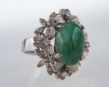 A Vintage jade and diamond cocktail ring, central jade cabouchon,