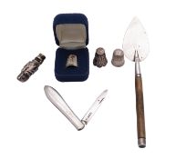 A small collection of silver, comprising: a novelty dog's head whistle, unmarked,