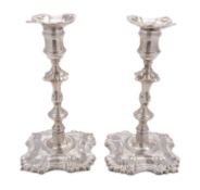A pair of late George II cast silver candlesticks by John Cafe, London 1753,