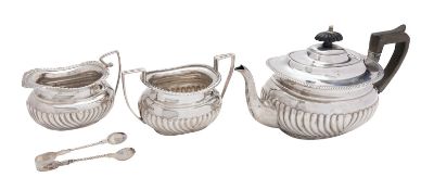 A matched silver three piece tea service, the tea pot by Hawksworth, Eyre & Co.