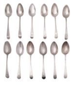 A matched set of twelve George III silver old English bright-cut tablespoons,