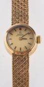 Omega a 9ct gold lady's wristwatch the dial with raised baton numerals and signed Omega Automatic,