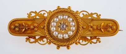 A Victorian gold brooch set with small diamond and seed pearls, in bloomed gold, unmarked, 4cm,