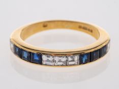 A sapphire & diamond set half eternity ring with square cut sapphires and diamonds in 18ct yellow